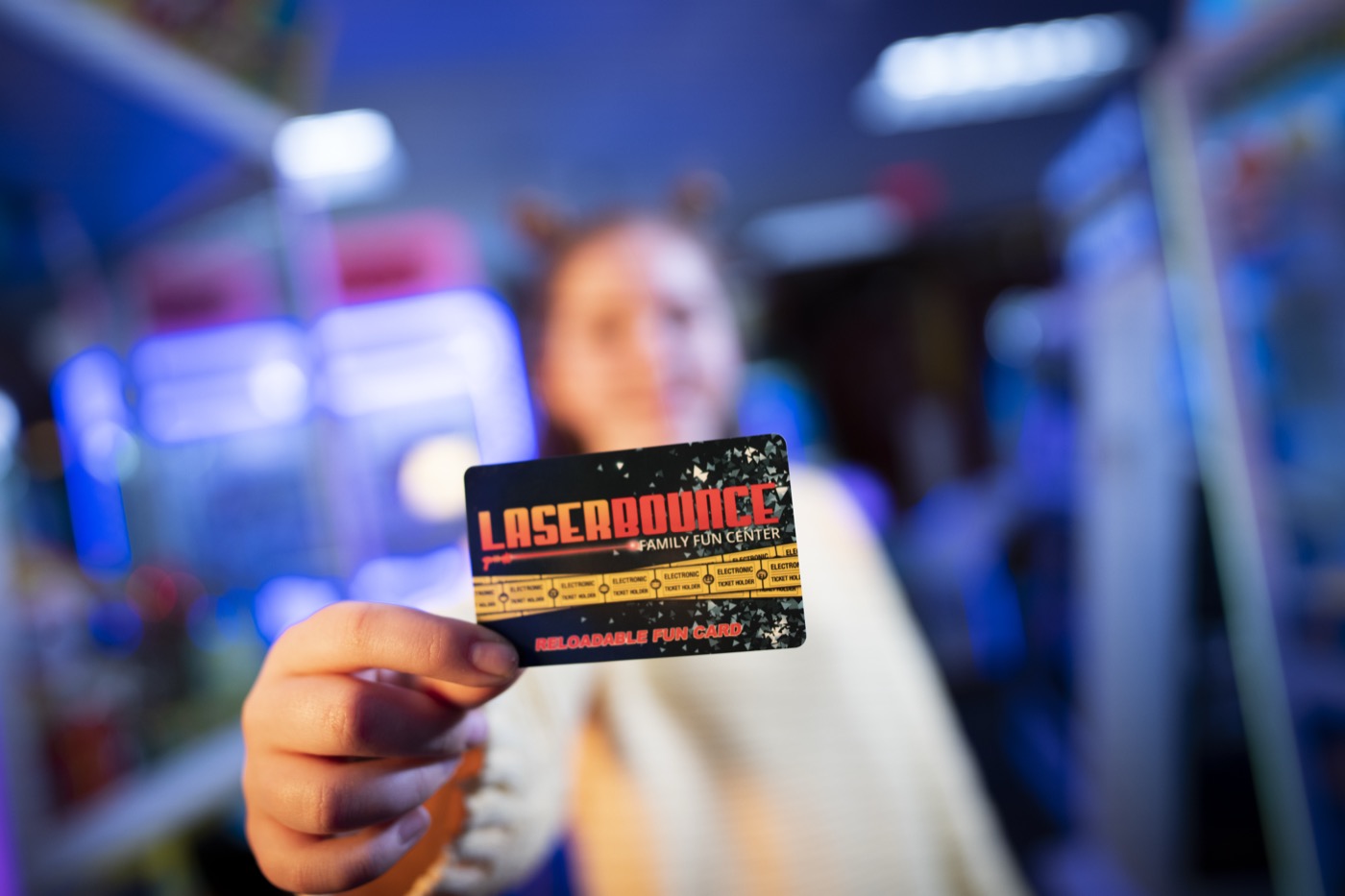 Laser Bounce game card held in the real Queens arcade